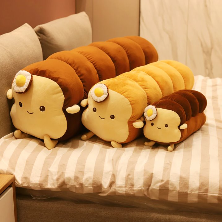 Benedict Bread - Loaf Edition plushy, He's a hunk of bread, and he's here to cuddle! Benedict Bread is the perfect addition to your bedtime routine. He's soft, he's cuddly, and he smells like freshly baked bread.